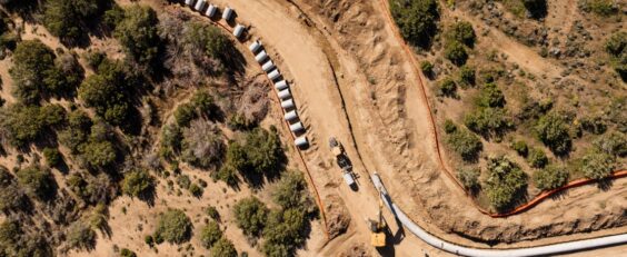 Curved road with pipe laid out to be installed